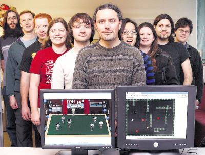 photo of faculty and students in game design lab