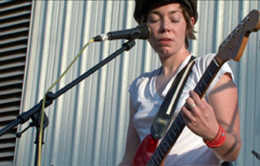 Heather McEntire plays guitar in soc doc exhibition