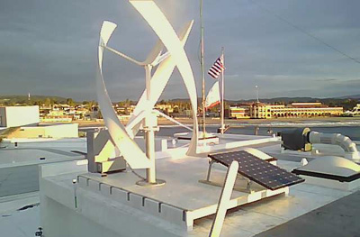 windmill and solar panels on wharf