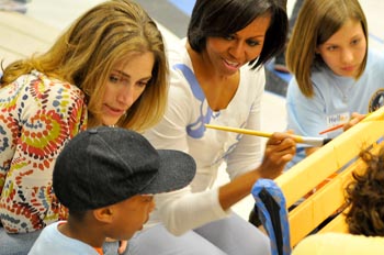 Rachel Goslins (left) with First Lady Michelle Obama and students