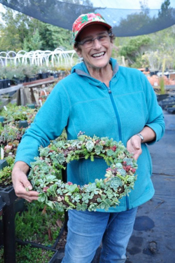 volunteer with succulent wreath