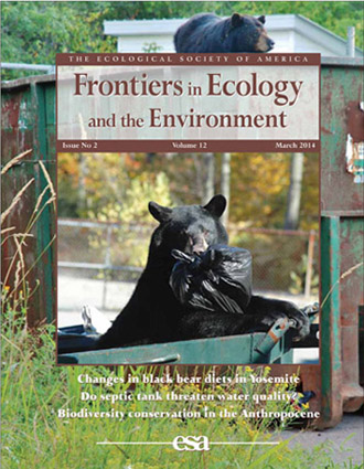 cover of journal with photo of bears in dumpster