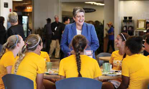 UC President Janet Napolitano talks with members of the UCSC women's soccer team during a visit to the Cowell College dining hall. (Photo by C. Lagattuta)