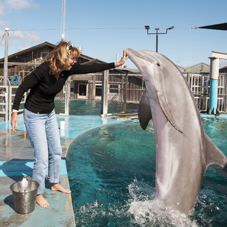 Terrie Williams with dolphin