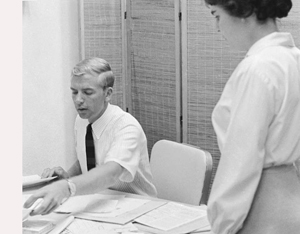 Jerry Walters, director of business services, with unidentified assistant, 1966