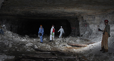 researchers inside a mine
