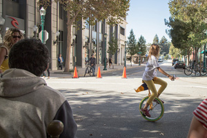 Aspiring alumna, 10-year-old Xochitl Leyva of Aptos, rode her slug-yellow unicycle along t