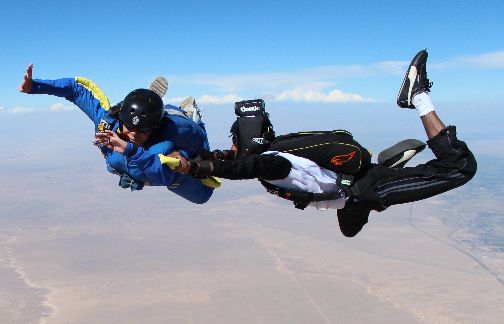 Nayak instructing a skydiving student (and being the videographer at the same time).