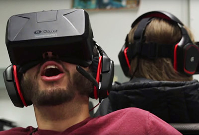 man wearing VR headset, expressing surprise
