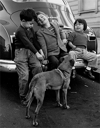 Pirkle Jones, Children on car bumper, 1948 (They Grow in the City series)