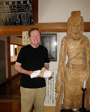 Gary Young next to sculpture in Japan