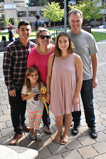 Katelynn August (front, center) arrives on campus with her family