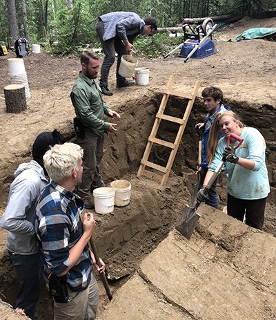students at archaeology site