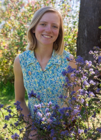 Photo of Nathalie Martin and flowers at the UCSC Arboretum