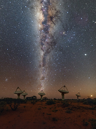 radio telescopes with night sky in background