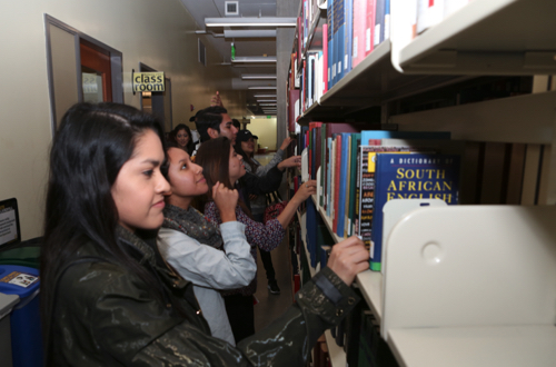 Students looking at books