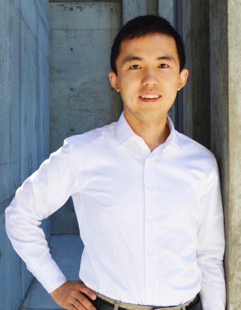 Kai Zhu standing outside a building on the UC Santa Cruz campus