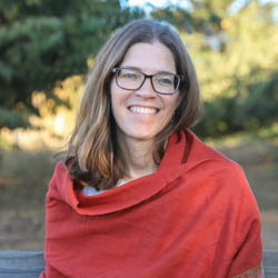 Professor Stacy Philpott poses outdoors on the UCSC campus