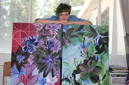 Connor Alexander, Work in Progress holding paintings
