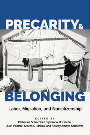 the book cover, featuring a photograph of clothes on a line outside a tent