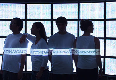 four people in silhouette with background of human genome sequence