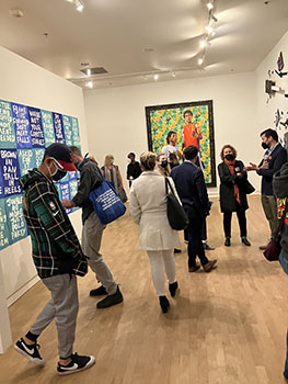Visitors enjoying the artworks at the Strange Weather exhibit. Photo by Dan White.