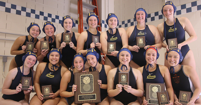 Photo of water polo team holding plaques