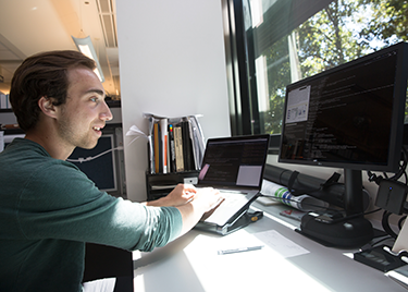 Roman Reggiardo works at his computer in Kim's lab.