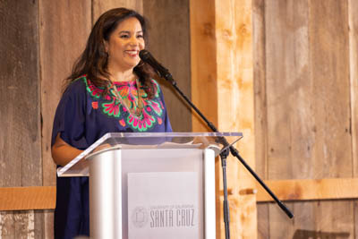 Sylvanna Falcón speaks at a UC Santa Cruz podium