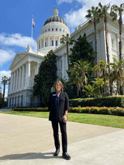 Rebecca London outside the state capitol building