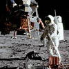 Astronaut Buzz Aldrin setting up a reflective device on the moon