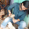 Chai Chang practices wood carving in Ghana