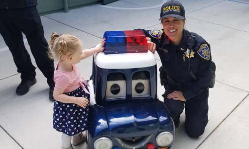 Lt. Garcia with a young child.