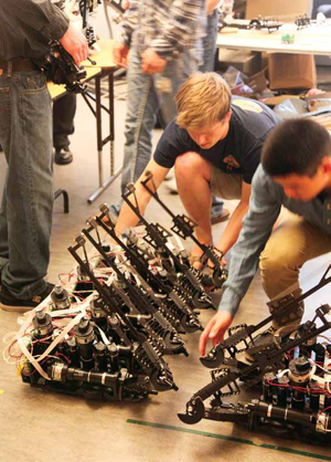 Students in computer engineer Jacob Rosen’s Bionics Lab work with components of an advanced robotic surgery system.