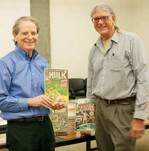 Jim Gunderson, left, and Peter Coha, dropping off their first batch of comics at Special C