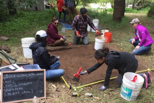 Photo of students excavating a site at the Castro Adobe.