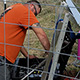 worker installing seismometer