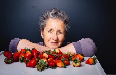 Portrait of Julie Guthman with strawberries