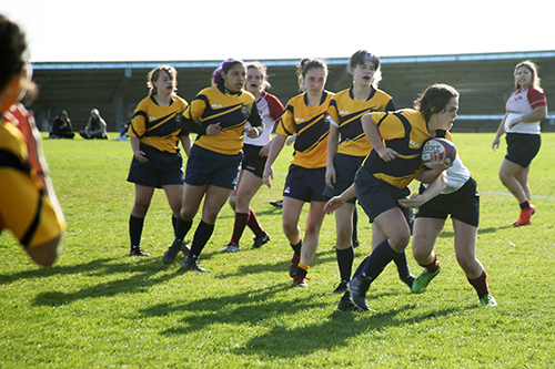rugby match with current UCSC women's team