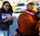 A UC Santa Cruz student works with community members to collect data