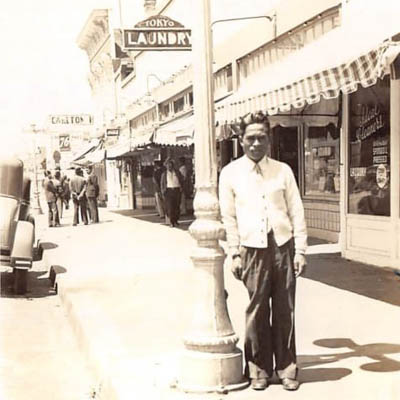 Dioscoro R. Recio standing on Main Street in Watsonville, circa 1930