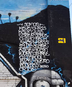 an example of placa style graffiti writing as part of a mural