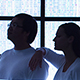 two people in silhouette with background of human genome sequence