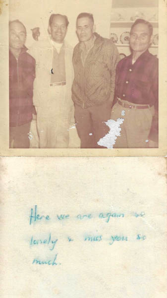 Group photo of men, note on the back says "here we are again, so lonely and miss you..."