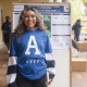 Claudia Paz Flores in front of science poster