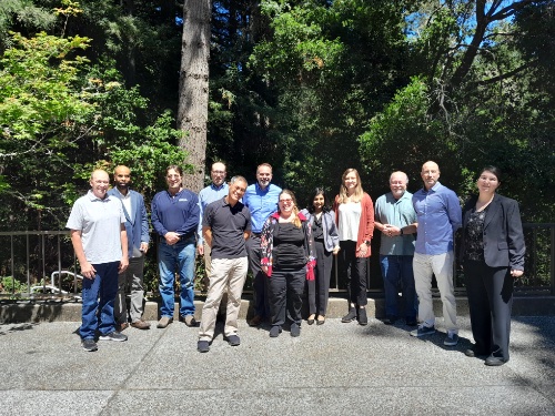 Group of PGE and UCSC employees standing outside looking at the camera