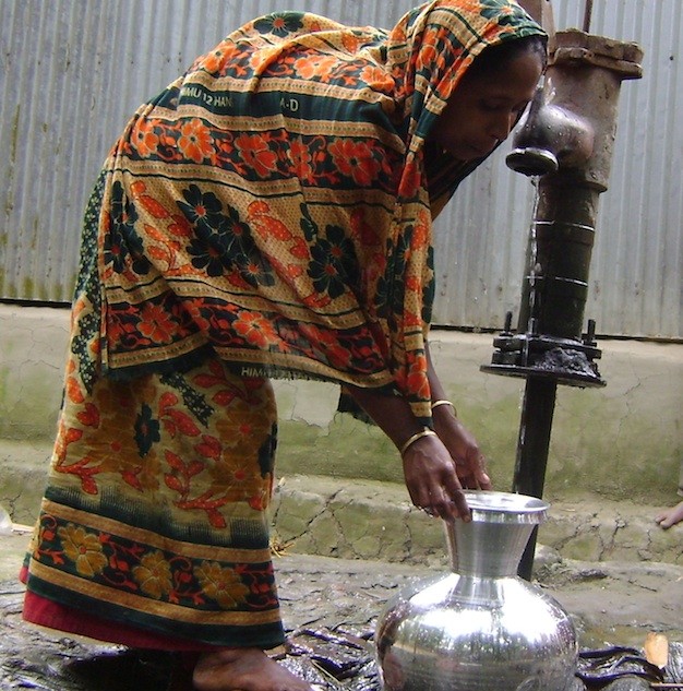 Bangladeshi woman collecting water