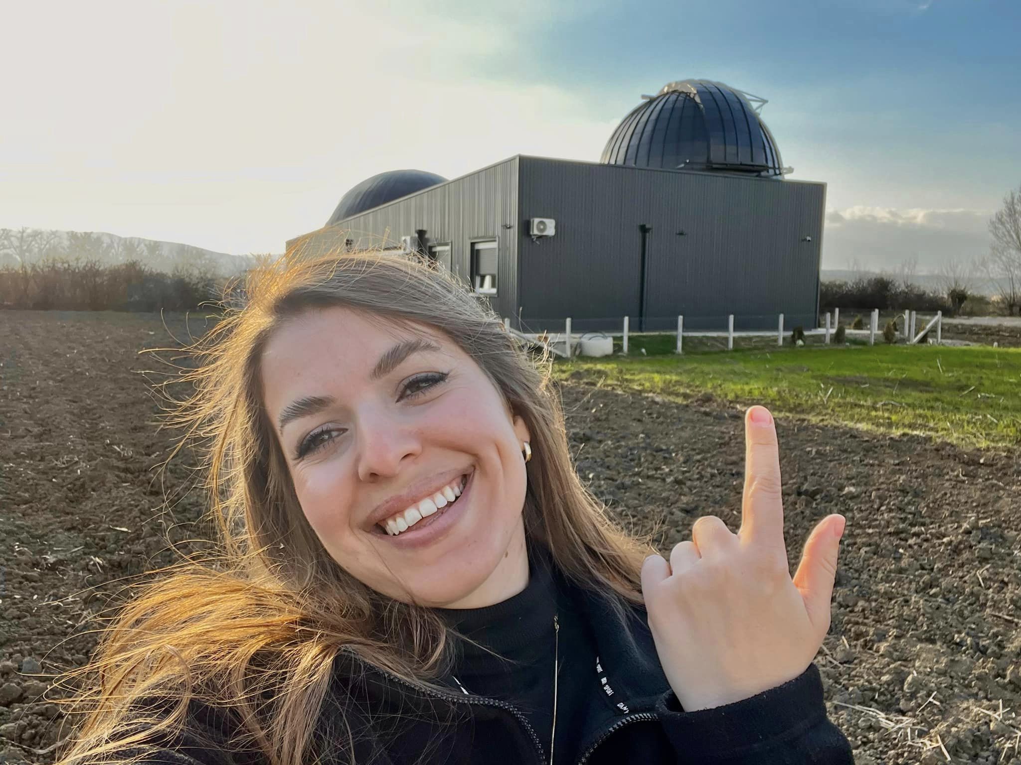 Woman pointing to observatory