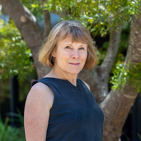 Portrait of Melissa Cline standing in front of a tree