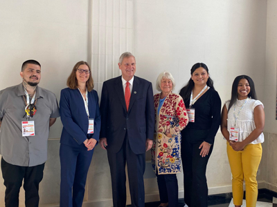 Stacy Philpott with members of the U.S. hackathon team and government administrators